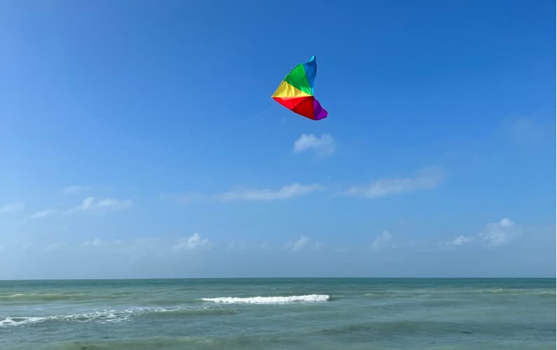 kite flying over the ocean
