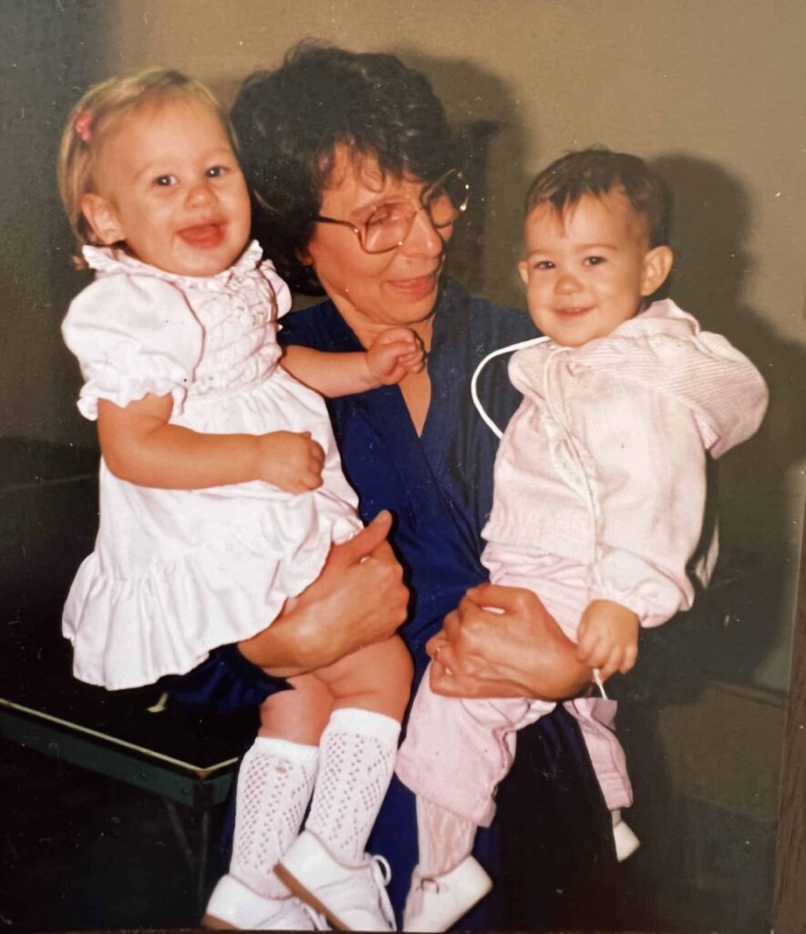 Grandma Maggie holding Jessica and Whitney