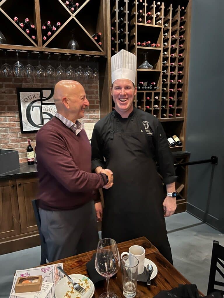 Diner shakes hands with Chef