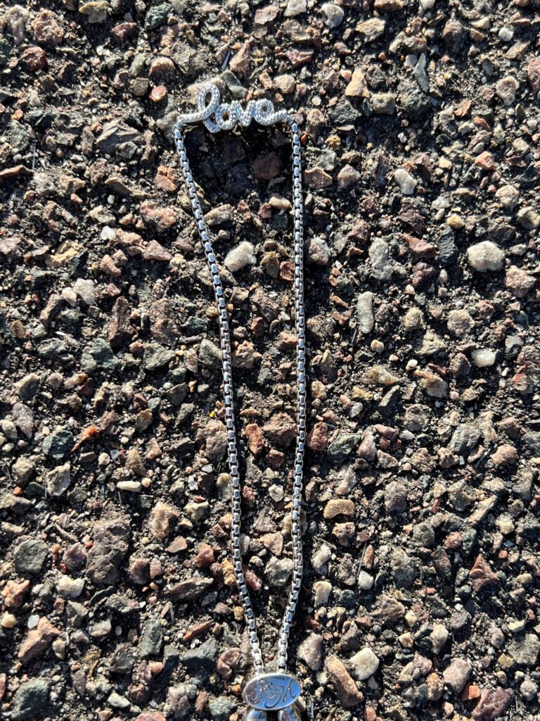 Love bracelet laying in street.