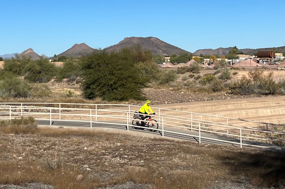 Man riding his bicycle on an Arizona trail. 