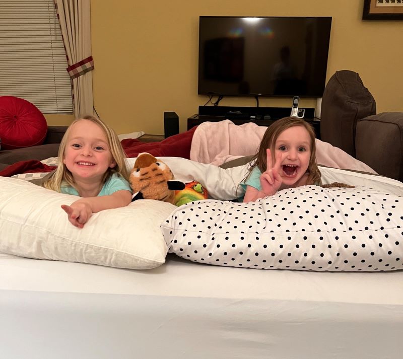 Tow four-year-old girls having a sleepover at Nana's.