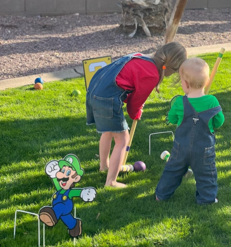 children playing croquet.