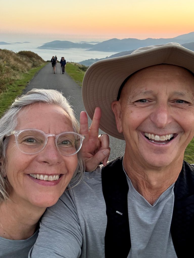 Two Happy Hikers. A couple at sun-up setting out for a day of hiking on The Camino Frances